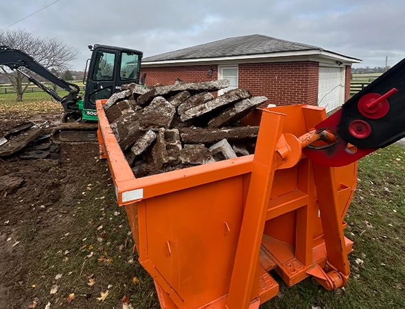 Rubble Jockey team placing a construction dumpster in Nicholasville, KY